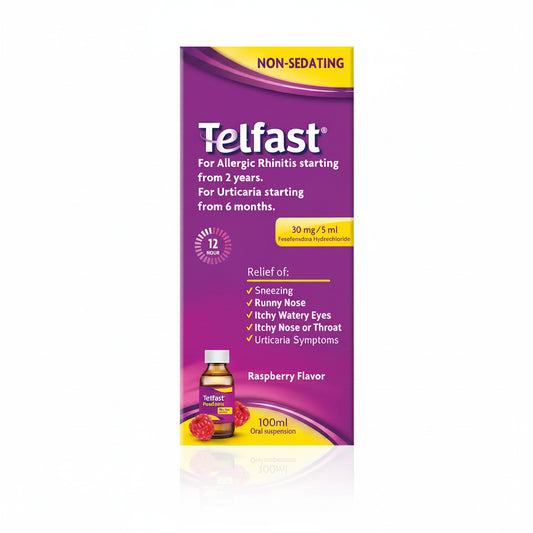 Telfast Non-Sedating oral suspension box, 100ml, raspberry flavor. The packaging is primarily purple with yellow accents, white text, and a small illustration of the amber bottle with a white cap and raspberry imagery at the bottom.